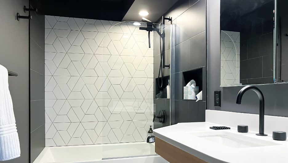 Modern bathroom interior with white sink and gray shower