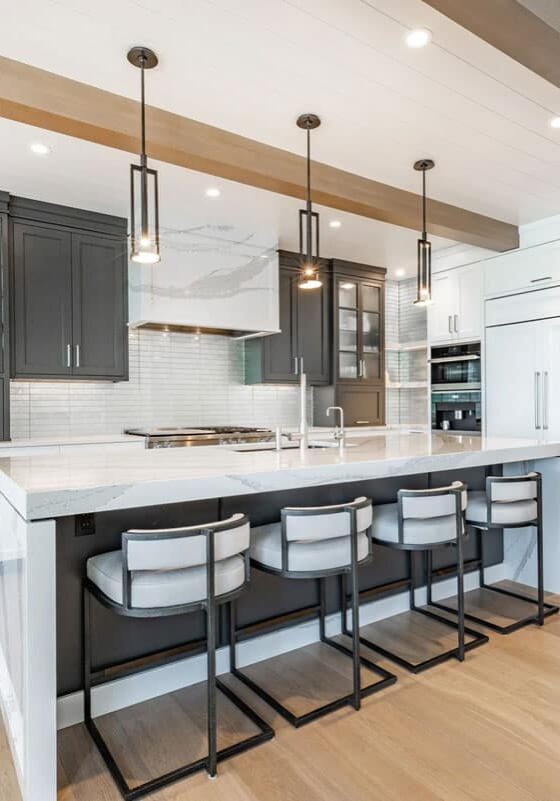 Kitchen island with barstools and pendant lights. Modern kitchen design