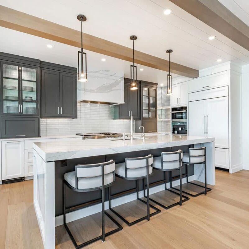 Modern kitchen with island and pendant lights Kitchen island with barstools and pendant lights. Modern kitchen design